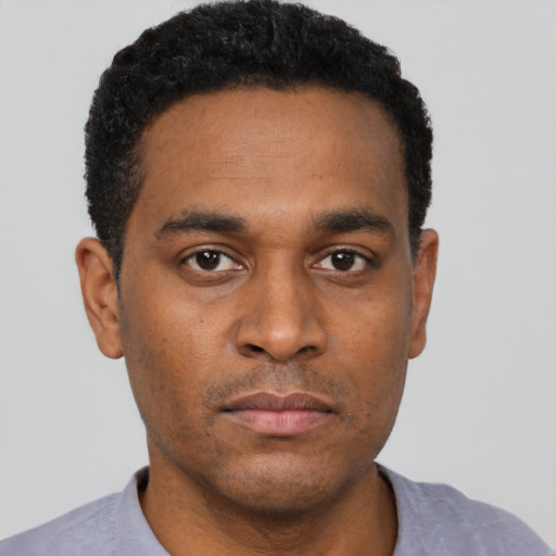 Neutral black young-adult male with short  black hair and brown eyes