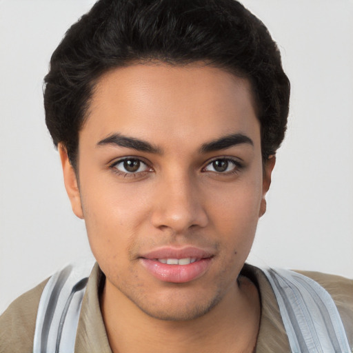 Joyful latino young-adult male with short  brown hair and brown eyes