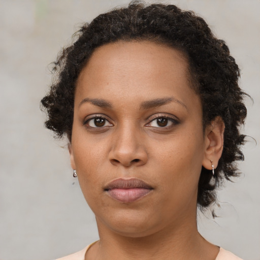 Neutral black young-adult female with short  brown hair and brown eyes