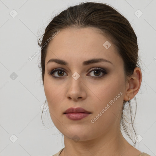 Neutral white young-adult female with medium  brown hair and brown eyes