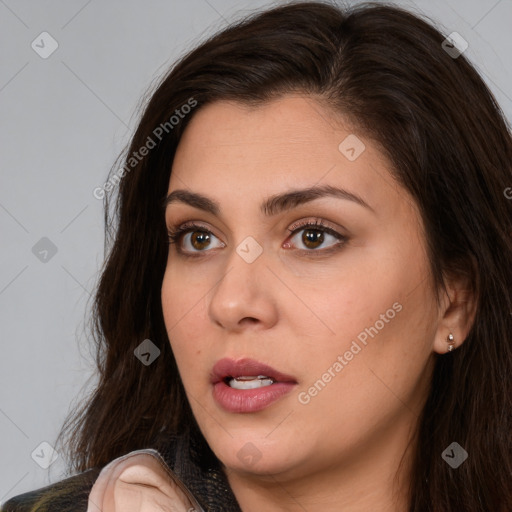 Neutral white young-adult female with long  brown hair and brown eyes