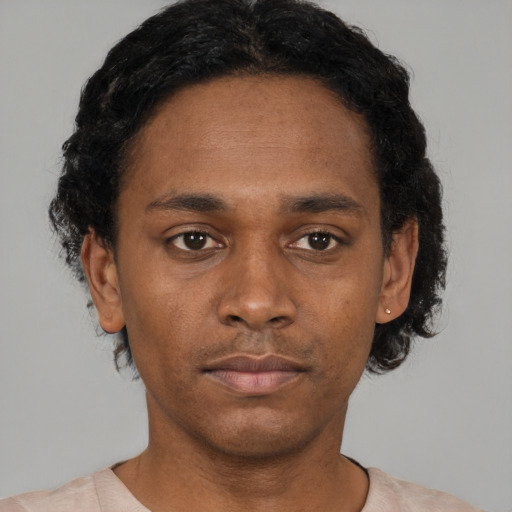 Neutral black young-adult male with short  black hair and brown eyes