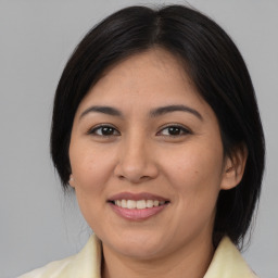 Joyful asian young-adult female with medium  brown hair and brown eyes