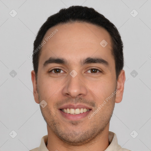 Joyful white young-adult male with short  black hair and brown eyes