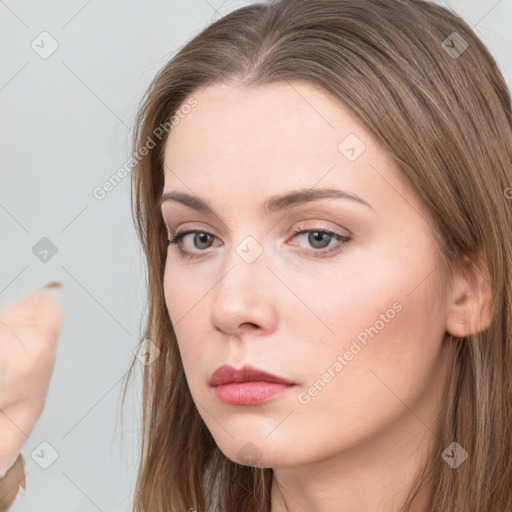 Neutral white young-adult female with long  brown hair and brown eyes