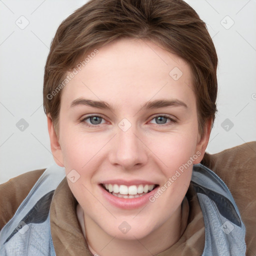 Joyful white young-adult female with short  brown hair and grey eyes