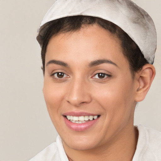 Joyful white young-adult female with short  brown hair and brown eyes