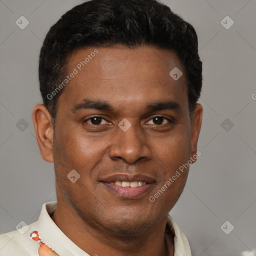 Joyful latino young-adult male with short  brown hair and brown eyes