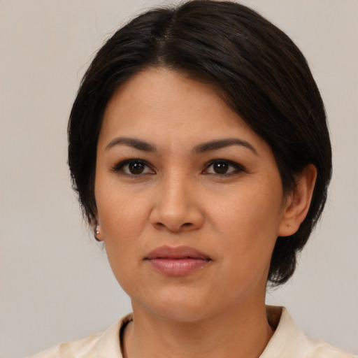 Neutral latino young-adult female with medium  brown hair and brown eyes