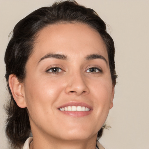 Joyful white young-adult female with medium  brown hair and brown eyes