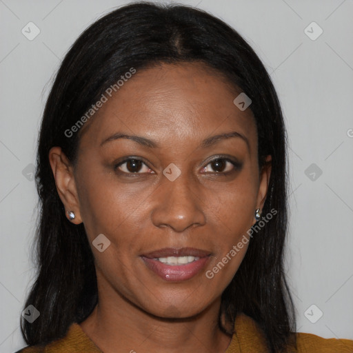 Joyful black young-adult female with long  brown hair and brown eyes