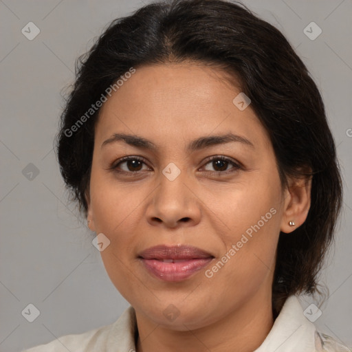 Joyful latino adult female with medium  brown hair and brown eyes