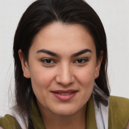 Joyful white young-adult female with medium  brown hair and brown eyes