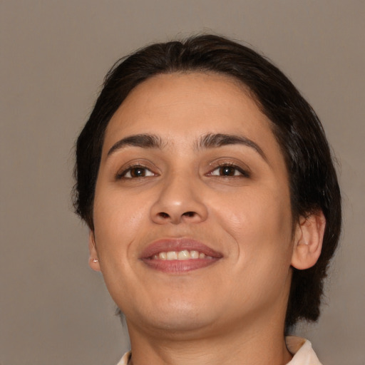 Joyful white young-adult female with medium  brown hair and brown eyes