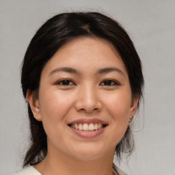 Joyful white young-adult female with medium  brown hair and brown eyes