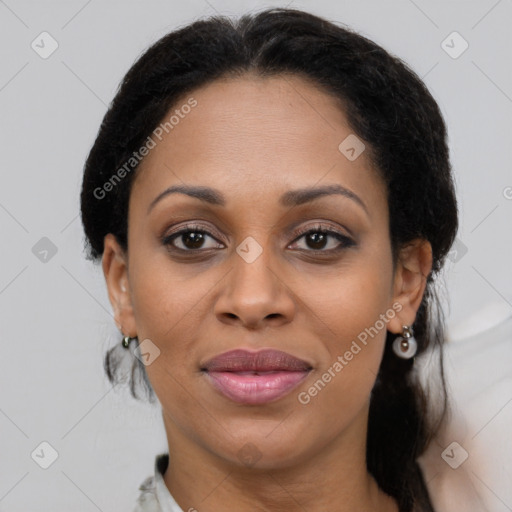 Joyful black young-adult female with medium  brown hair and brown eyes