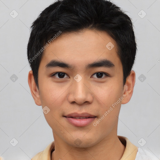 Joyful asian young-adult male with short  black hair and brown eyes