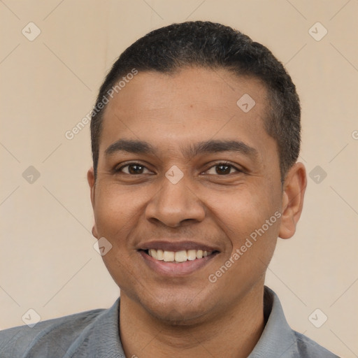 Joyful latino young-adult male with short  black hair and brown eyes