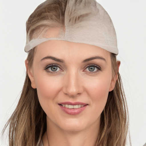 Joyful white young-adult female with long  brown hair and grey eyes