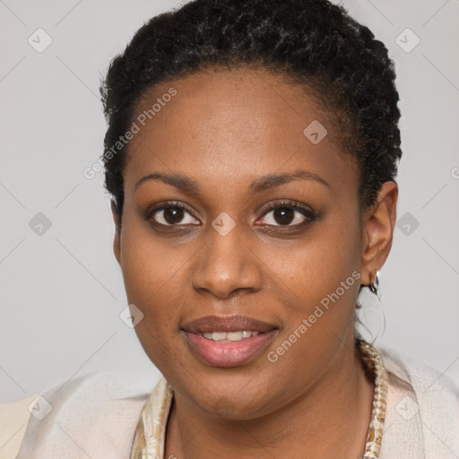 Joyful black young-adult female with short  brown hair and brown eyes