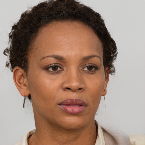 Neutral black adult female with short  brown hair and brown eyes