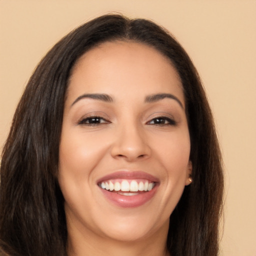 Joyful white young-adult female with long  brown hair and brown eyes