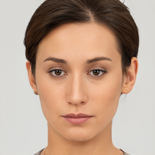 Neutral white young-adult female with short  brown hair and brown eyes