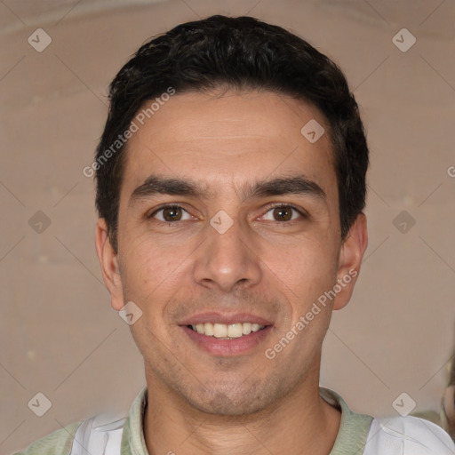 Joyful white young-adult male with short  black hair and brown eyes