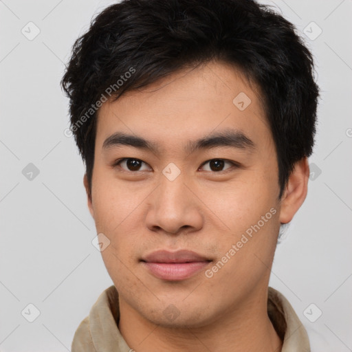 Joyful asian young-adult male with short  brown hair and brown eyes