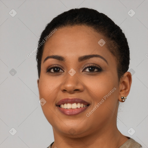 Joyful latino young-adult female with short  black hair and brown eyes