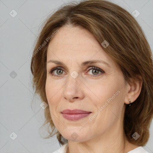 Joyful white adult female with medium  brown hair and brown eyes