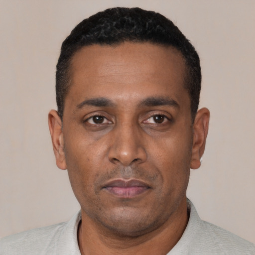 Neutral black young-adult male with short  black hair and brown eyes