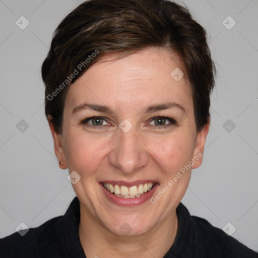 Joyful white adult female with medium  brown hair and grey eyes