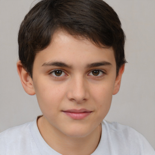 Joyful white child male with short  brown hair and brown eyes