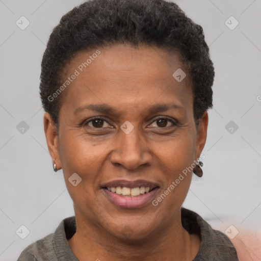 Joyful black adult female with short  brown hair and brown eyes