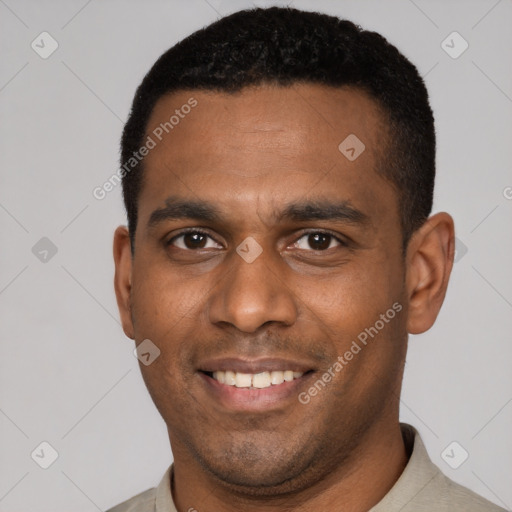 Joyful latino young-adult male with short  black hair and brown eyes