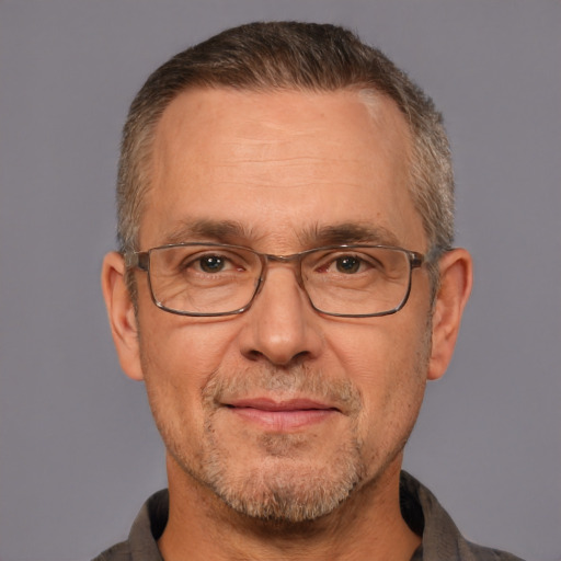 Neutral white middle-aged male with short  gray hair and brown eyes