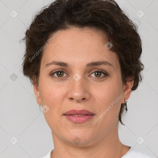 Joyful white adult female with short  brown hair and brown eyes