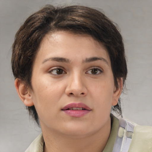 Joyful white young-adult female with medium  brown hair and brown eyes