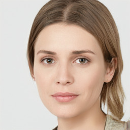 Joyful white young-adult female with medium  brown hair and green eyes