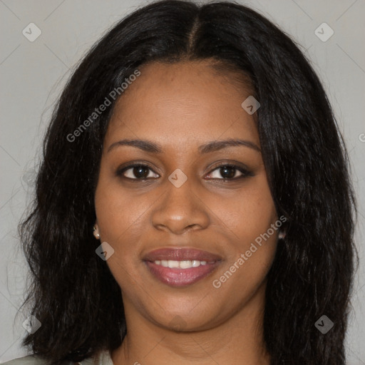 Joyful black young-adult female with long  brown hair and brown eyes