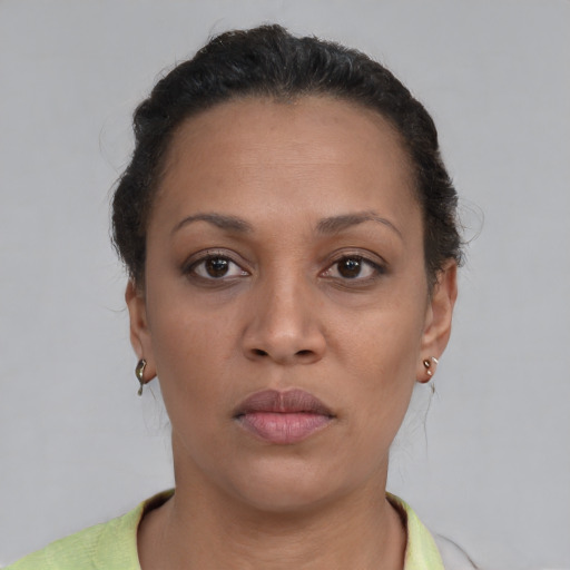 Neutral black adult female with short  brown hair and brown eyes