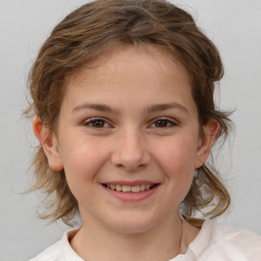 Joyful white child female with medium  brown hair and brown eyes