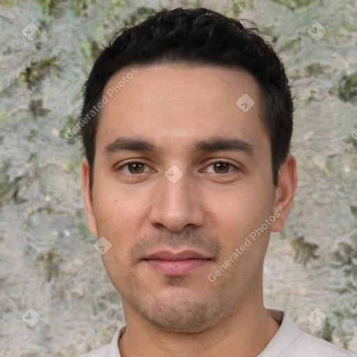 Joyful white young-adult male with short  black hair and brown eyes