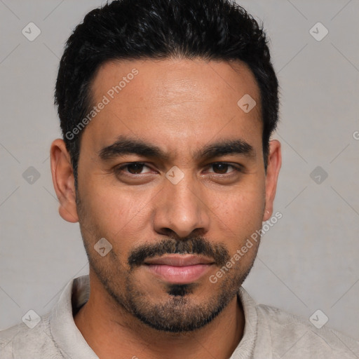 Joyful latino young-adult male with short  black hair and brown eyes