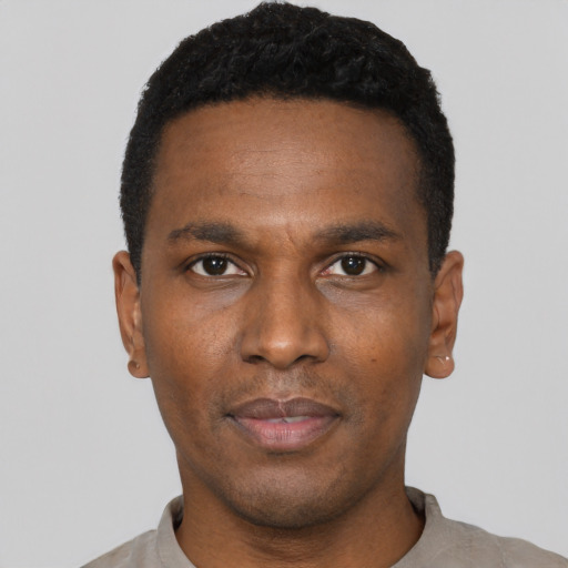 Neutral black young-adult male with short  black hair and brown eyes