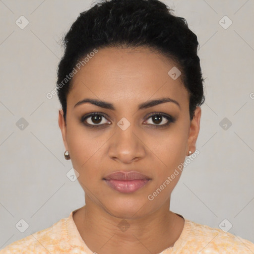 Joyful latino young-adult female with short  black hair and brown eyes