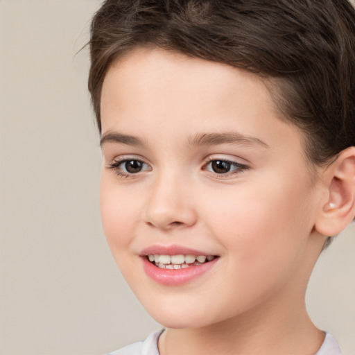 Joyful white child female with short  brown hair and brown eyes