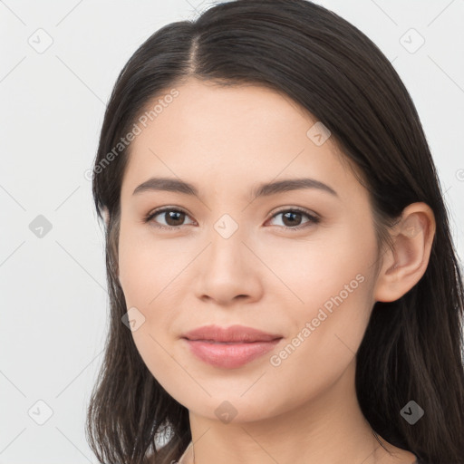 Joyful asian young-adult female with long  brown hair and brown eyes