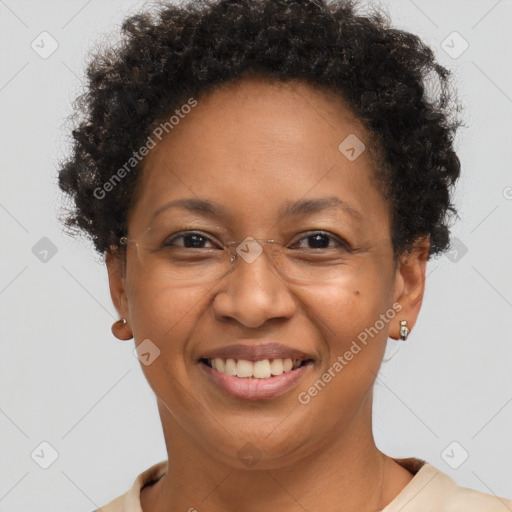 Joyful black adult female with short  brown hair and brown eyes